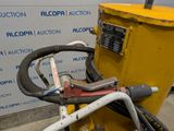a close up of a machine with a hose attached to it