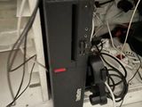 a computer that is sitting on top of a shelf