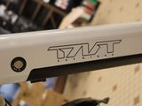 a close up of a bike with a logo on it