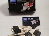 a box of keys and a credit card sitting on a table