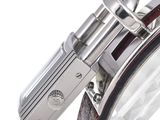 a close up of a watch on a white background