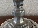a candle that is sitting on top of a doily