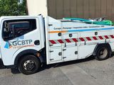 a picture of a utility truck parked in a parking lot