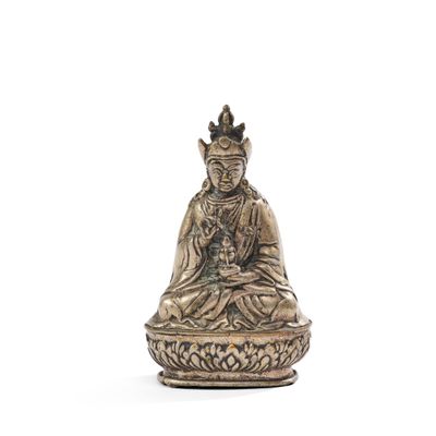 an image of a statue of a person sitting in a lotus position