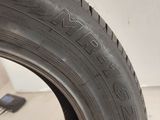 a close up of a tire with a tire wren on it