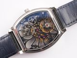 a close up of a wrist watch with a blue dial