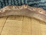 a piece of wood that is sitting on top of a chair