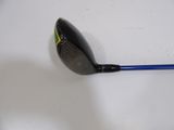 a close up of a golf club on a white surface