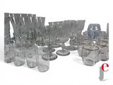 a lot of glasses that are sitting on a table