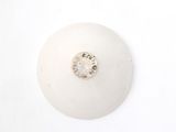 a white ball with a diamond on it on a white surface