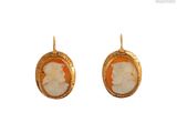 an image of a pair of earrings with a picture of a woman