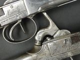 a gun that is on display on a table