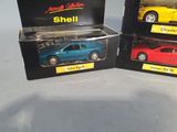 three toy cars are in a box on a table