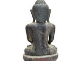 an image of a statue of a person sitting on top of a table