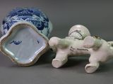 two figurines that are sitting next to each other