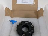 a box with a piece of paper and a tool inside of it