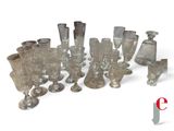 a lot of glass vases that are sitting on a table