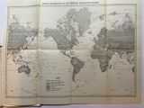 an old map of the world on a table with a cup of coffee