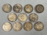 a close up of a bunch of coins sitting on top of a table