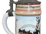 a beer mug that has a picture of a horse and rider on it