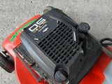 a lawn mower that is sitting on the ground