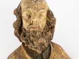 a close up of a statue of a man with a beard