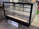 a glass display case that is sitting in a warehouse