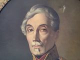 portrait of a man in a military uniform in a gold frame
