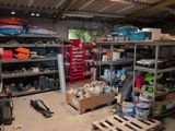 a garage filled with lots of tools and supplies