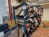 a large pile of shoes on a shelf in a room