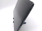 a laptop that is sitting on a stand on a table