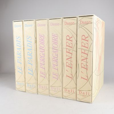 four books in a row on a white surface with a gray background
