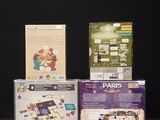 three boxes of nintendo wii games sitting on a black surface