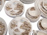 a lot of plates and bowls sitting on a table