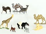 a lot of different animal figurines on a white surface