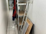 a ladder leaning up against a wall in a hallway