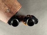 a pair of binoculars sitting next to each other on a table