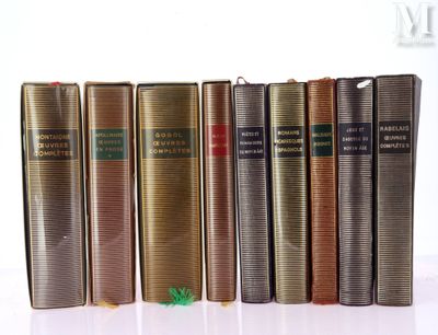 books are lined up in a row on a white surface
