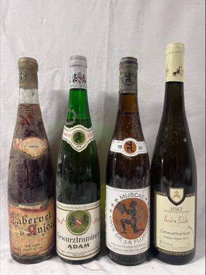 several bottles of wine are lined up on a table