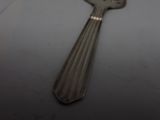 a spoon that is sitting on top of a table