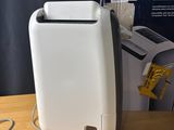 a box with a paper towel dispenser in it on a table