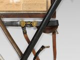 an image of a couple of knives and a case on a table