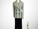 an image of a mannequin dressed in a gray coat and black skirt