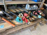 many different tools on a table in a garage