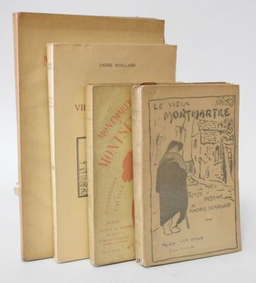 three books sitting on top of each other on a white surface