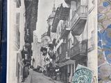 a picture of a postcard with a picture of a street