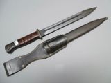 two knives that are sitting next to each other on a table