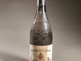 a bottle of wine that is sitting on a table