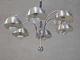 a chandelier with five lamps hanging from the ceiling