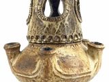 a brown vase with a hole in it on a white background